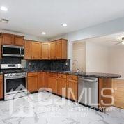 19 Madison Drive Helmetta, NJ 08828 - Photo 16 of 45 a kitchen with stainless steel appliances granite countertop a stove a sink and a microwave