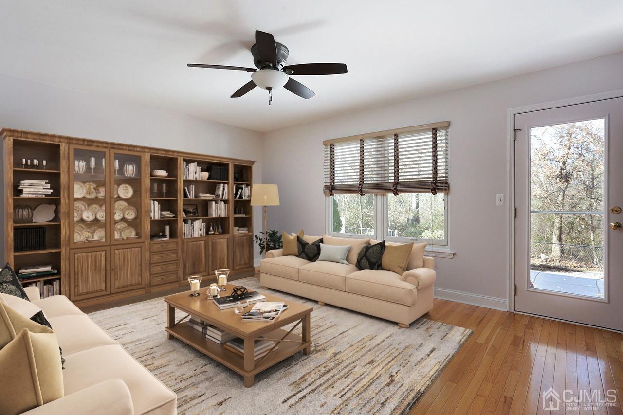 19 Madison Drive Helmetta, NJ 08828 - Photo 19 of 45 a living room with furniture and a large window