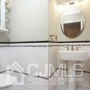 19 Madison Drive Helmetta, NJ 08828 - Photo 25 of 45 a bathroom with a sink and mirror