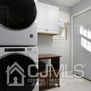 19 Madison Drive Helmetta, NJ 08828 - Photo 26 of 45 a utility room with sink dryer and washer