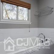 19 Madison Drive Helmetta, NJ 08828 - Photo 29 of 45 a bathroom with a sink and a window