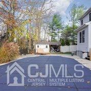 19 Madison Drive Helmetta, NJ 08828 - Photo 43 of 45 a view of outdoor space with signage and flags