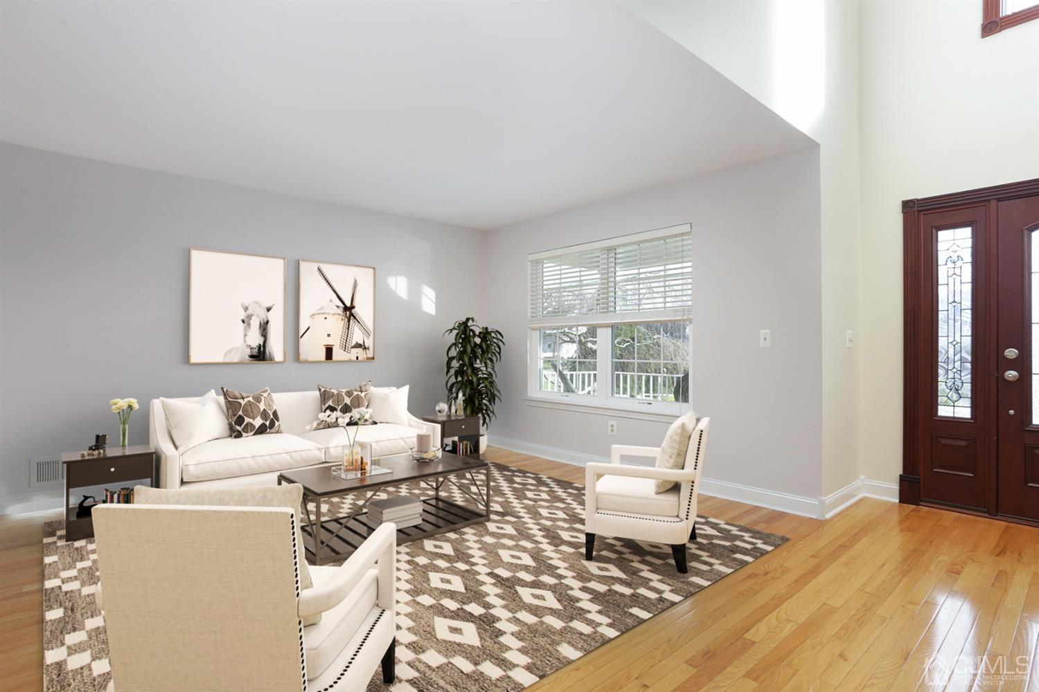 19 Madison Drive Helmetta, NJ 08828 - Photo 8 of 45 a living room with furniture and a window