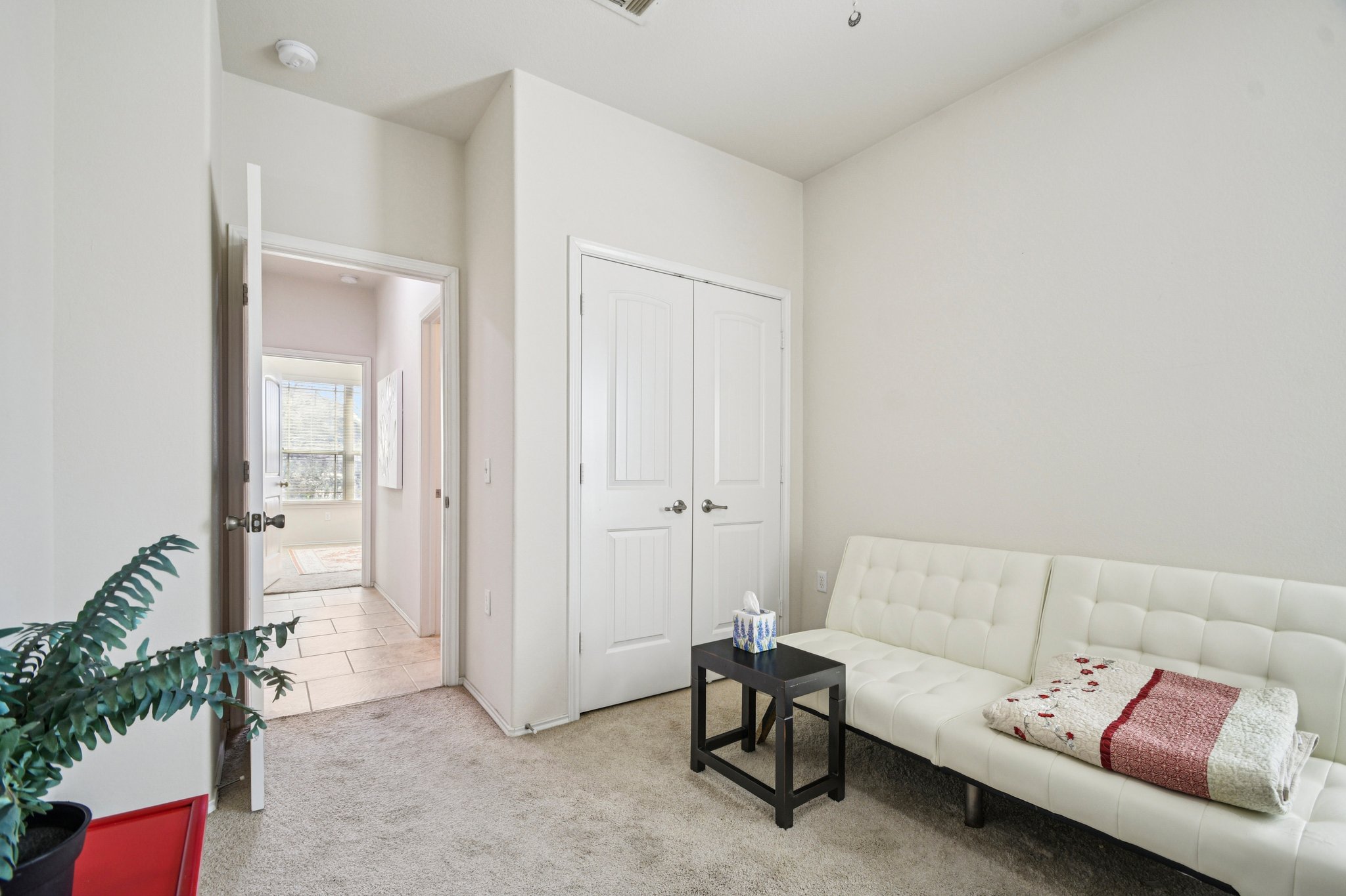 10221 Pinnacle Crest Loop Austin, TX 78747 - Photo 12 of 19 a living room with furniture and a potted plant
