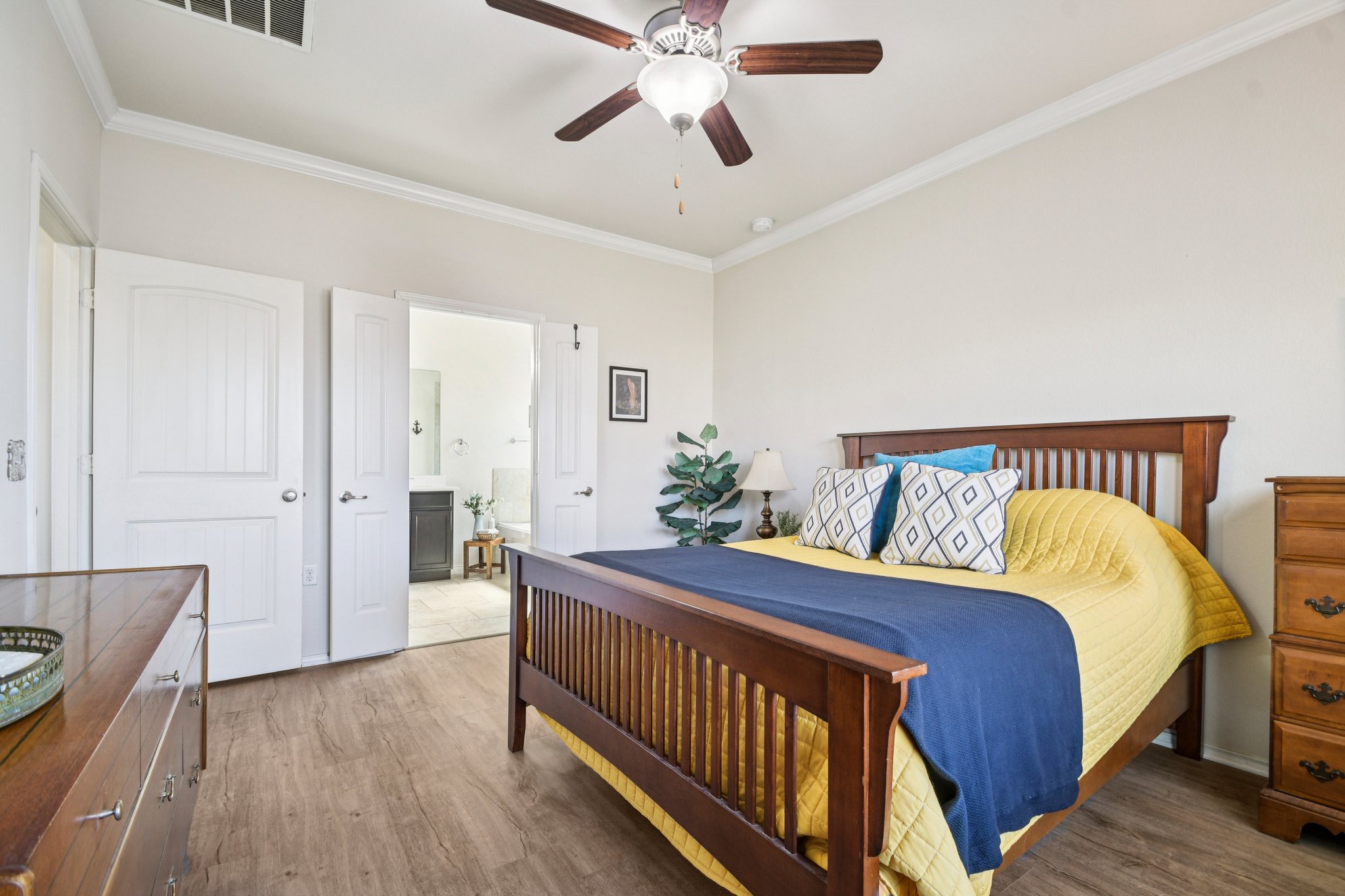 10221 Pinnacle Crest Loop Austin, TX 78747 - Photo 15 of 19 a bedroom with a bed and a chandelier