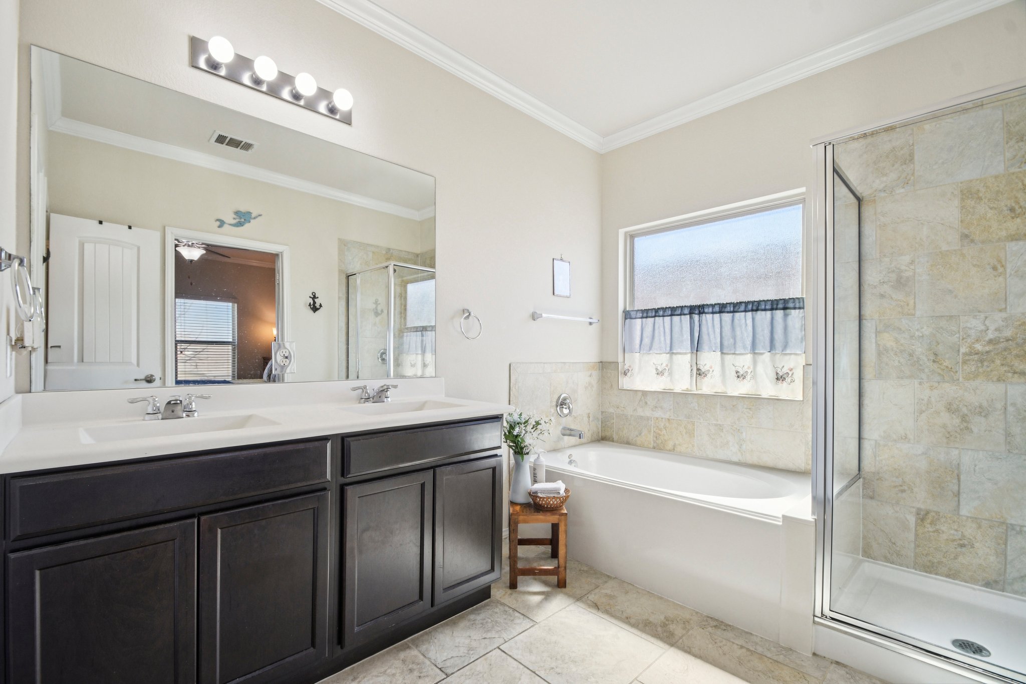 10221 Pinnacle Crest Loop Austin, TX 78747 - Photo 16 of 19 a bathroom with a tub a sink and mirror
