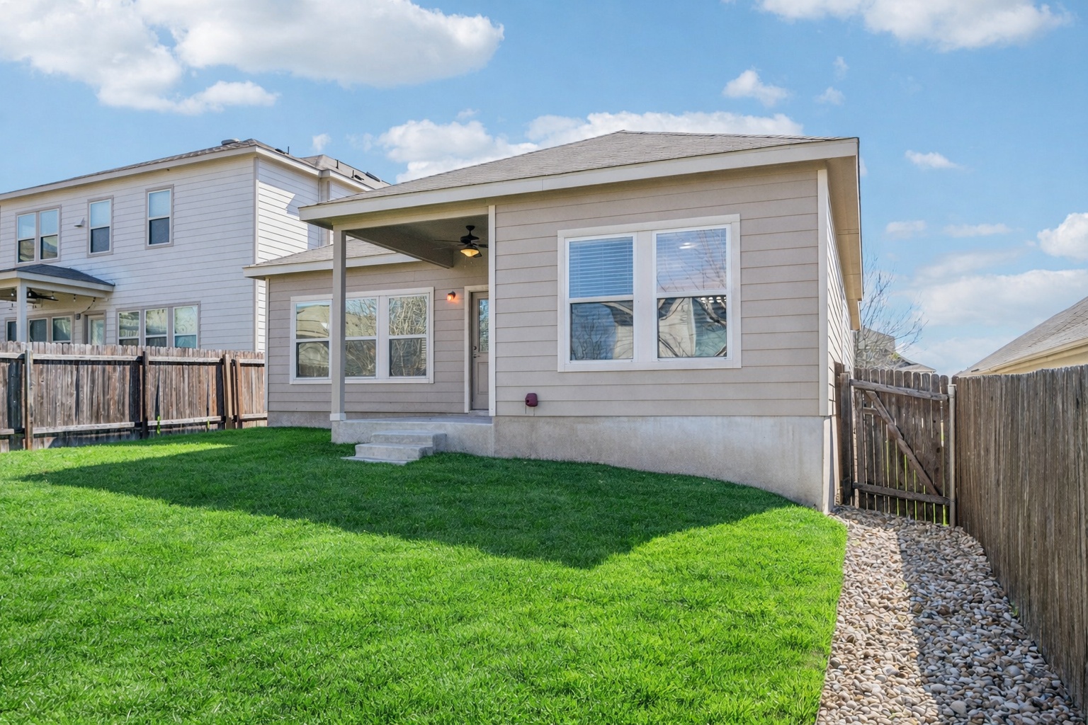 10221 Pinnacle Crest Loop Austin, TX 78747 - Photo 18 of 19 a view of an house with backyard space and garden