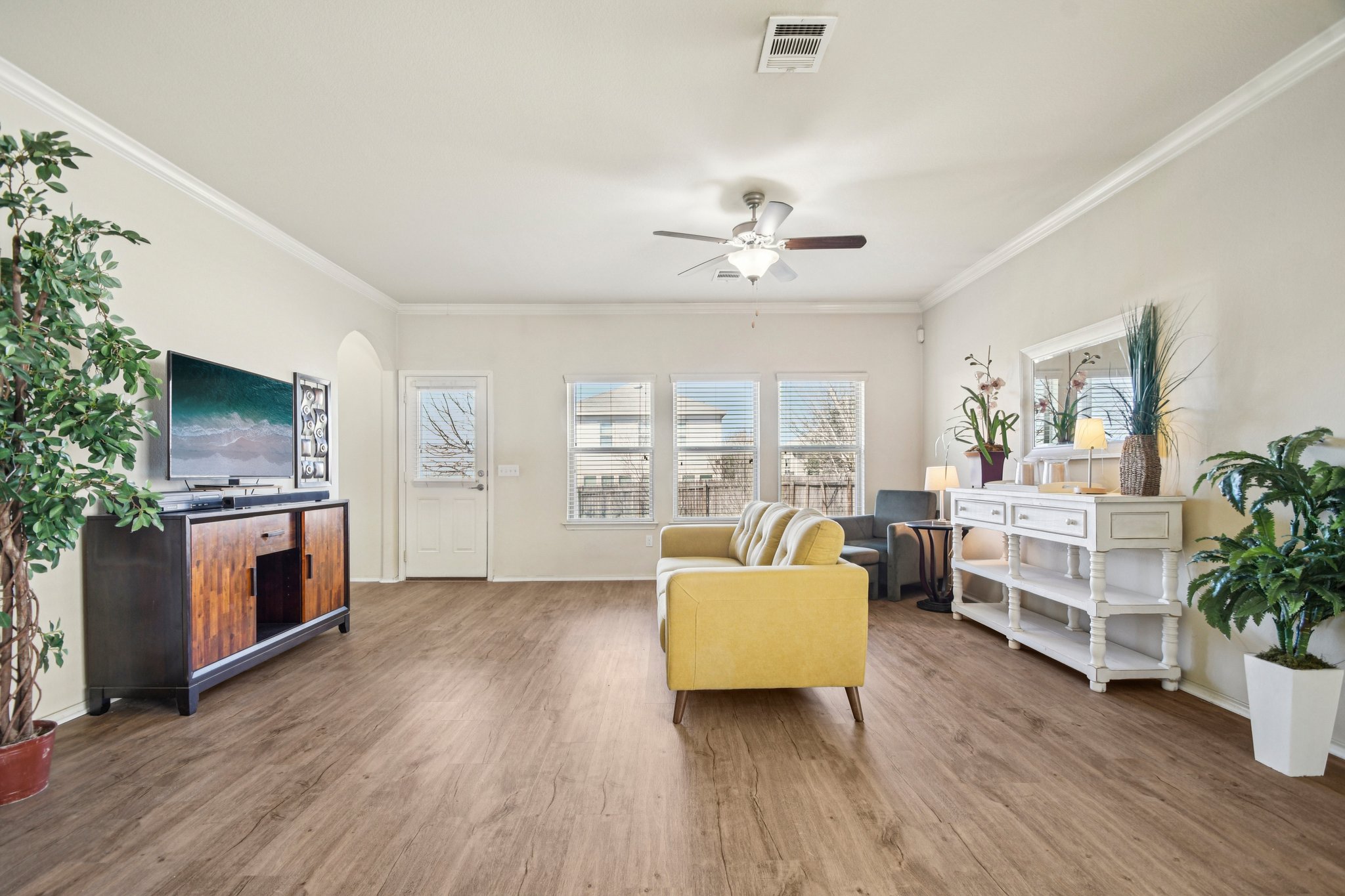 10221 Pinnacle Crest Loop Austin, TX 78747 - Photo 8 of 19 a living room with furniture and a flat screen tv