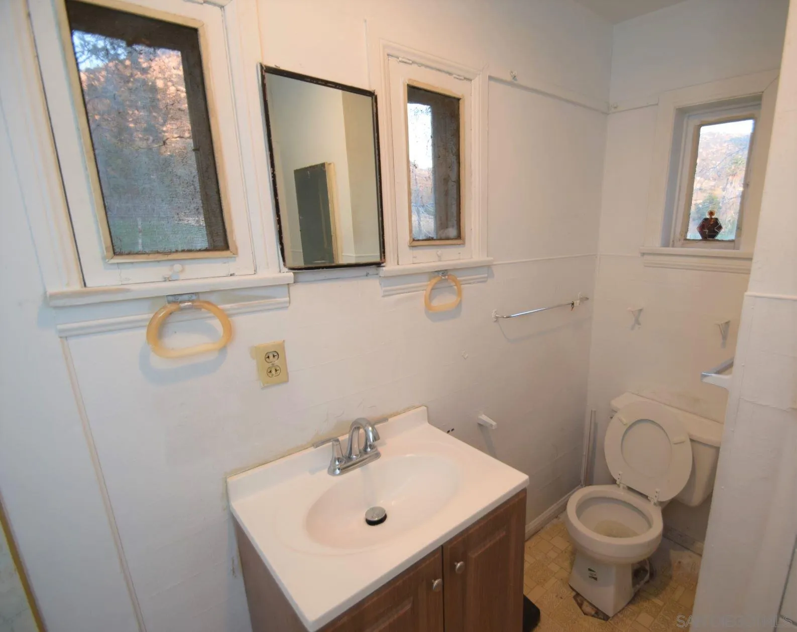 5557 Rainbow Creek Road Fallbrook, CA 92028 - Photo 17 of 24 a bathroom with a toilet sink and mirror