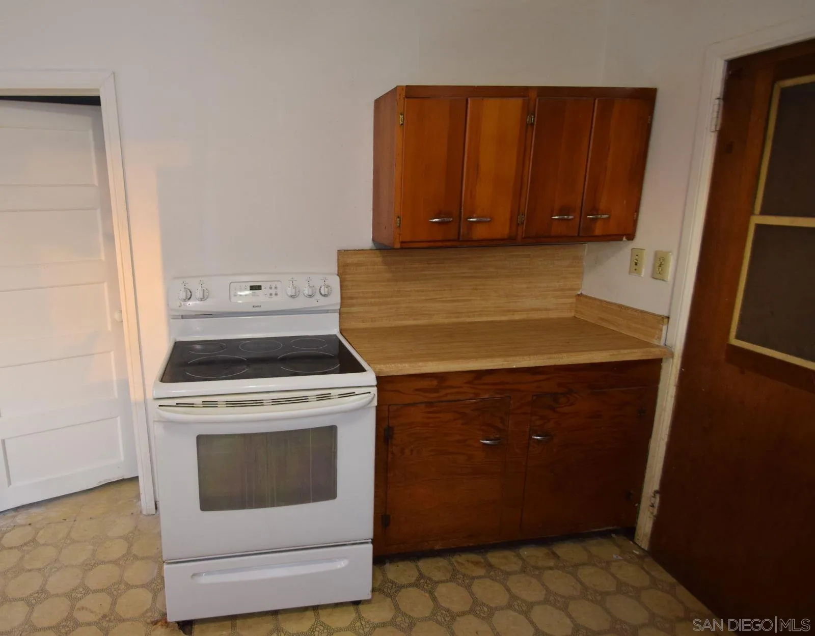 5557 Rainbow Creek Road Fallbrook, CA 92028 - Photo 22 of 24 a kitchen with a stove and a cabinet
