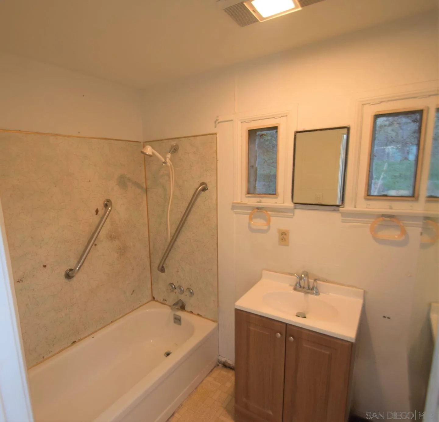 5557 Rainbow Creek Road Fallbrook, CA 92028 - Photo 24 of 24 a bathroom with a sink and mirror with bathtub