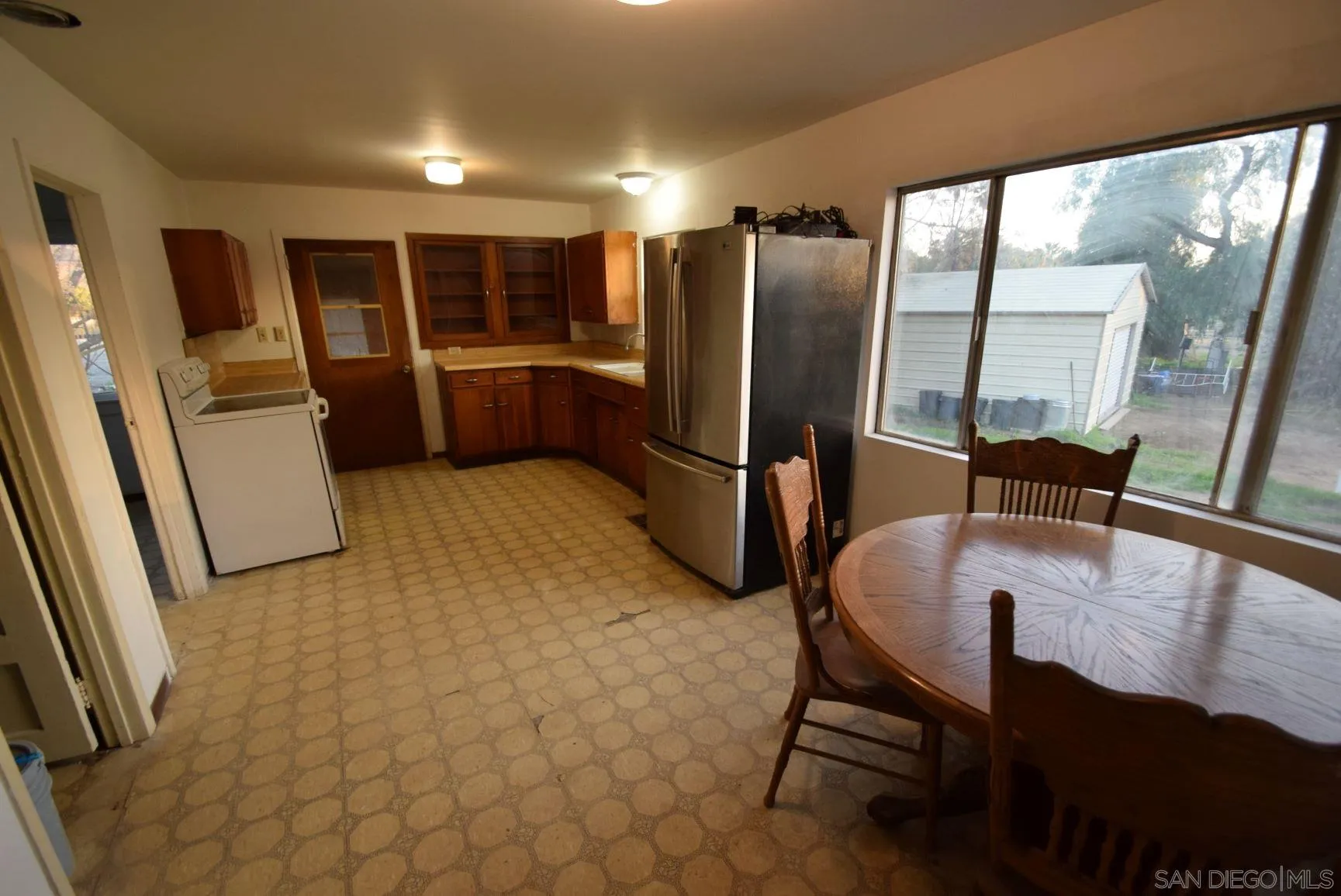 5557 Rainbow Creek Road Fallbrook, CA 92028 - Photo 7 of 24 a view of kitchen with granite countertop window and refrigerator