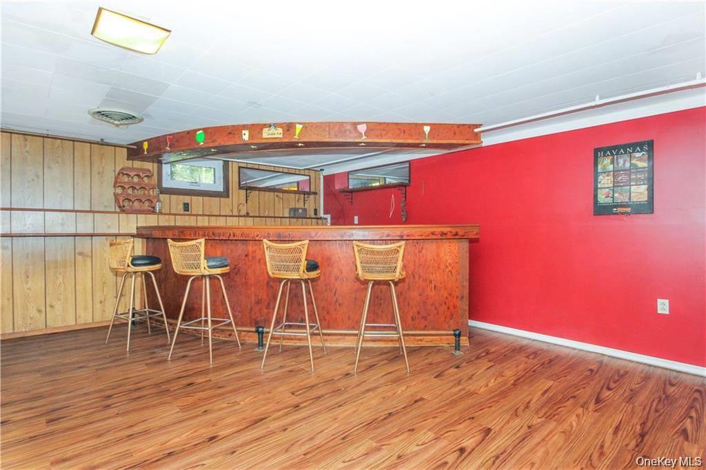 26 Montrose Point Road Montrose, NY 10548 - Photo 12 of 20 an empty room with wooden floor and windows