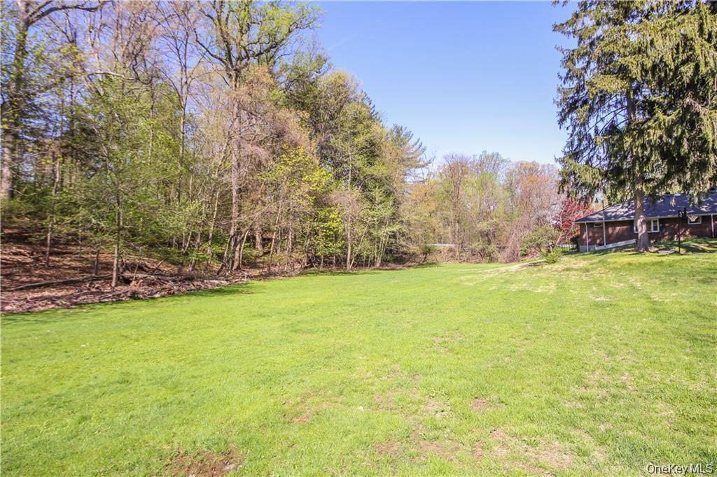 26 Montrose Point Road Montrose, NY 10548 - Photo 20 of 20 a view of yard with swimming pool and green space
