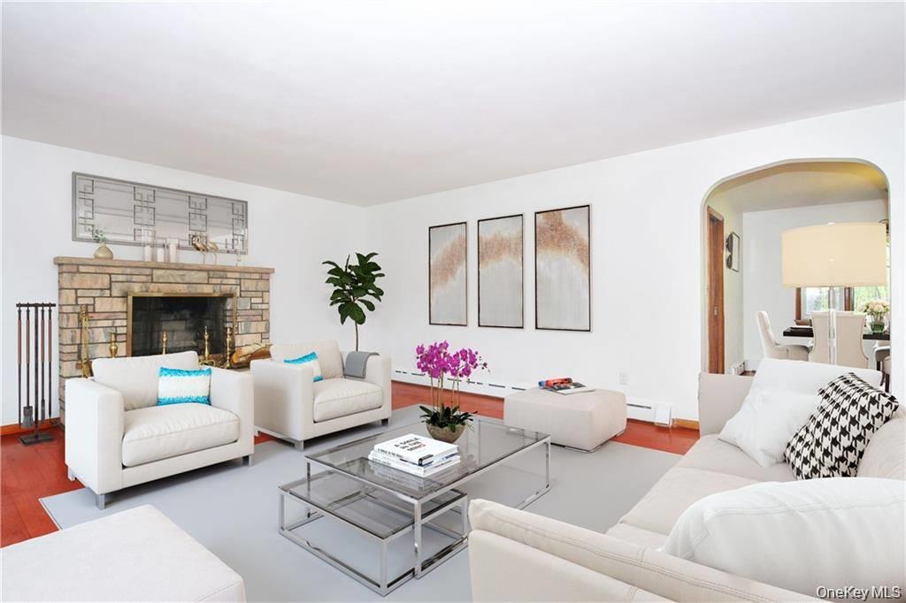 26 Montrose Point Road Montrose, NY 10548 - Photo 6 of 20 a living room with furniture and a fireplace