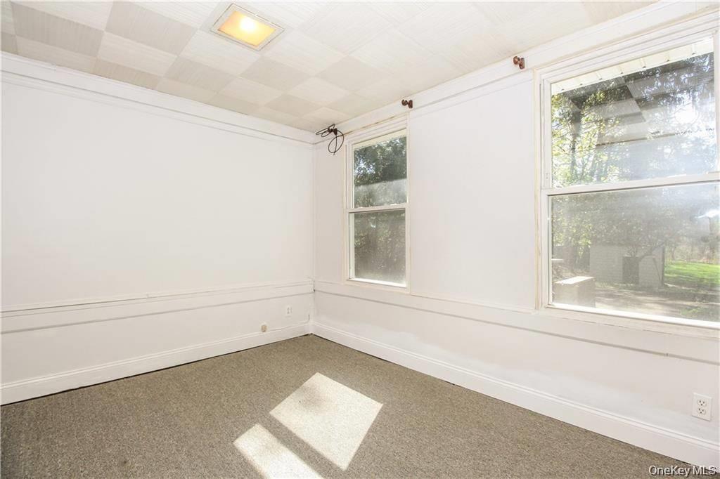 26 Montrose Point Road Montrose, NY 10548 - Photo 9 of 20 a view of an empty room with a window