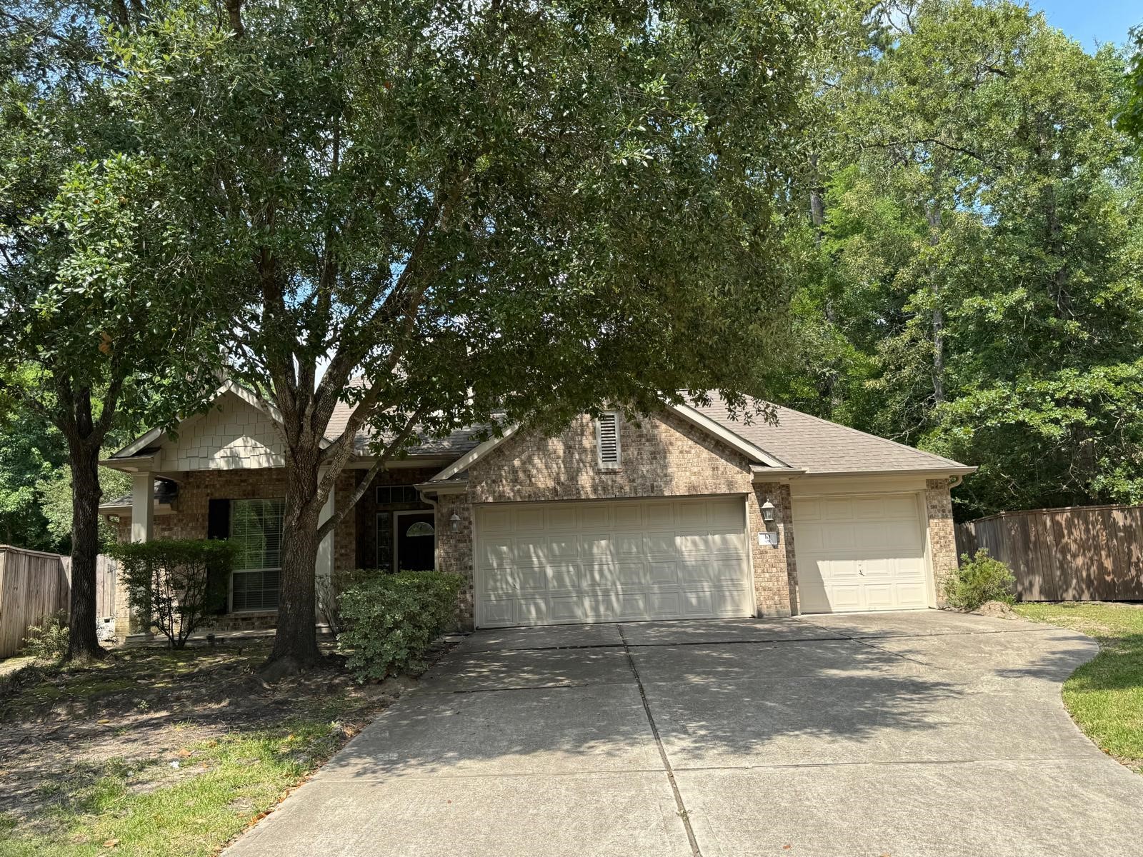10 Barker Ridge Court Spring, TX 77382 - Photo 1 of 29 a front view of a house with a yard and garage