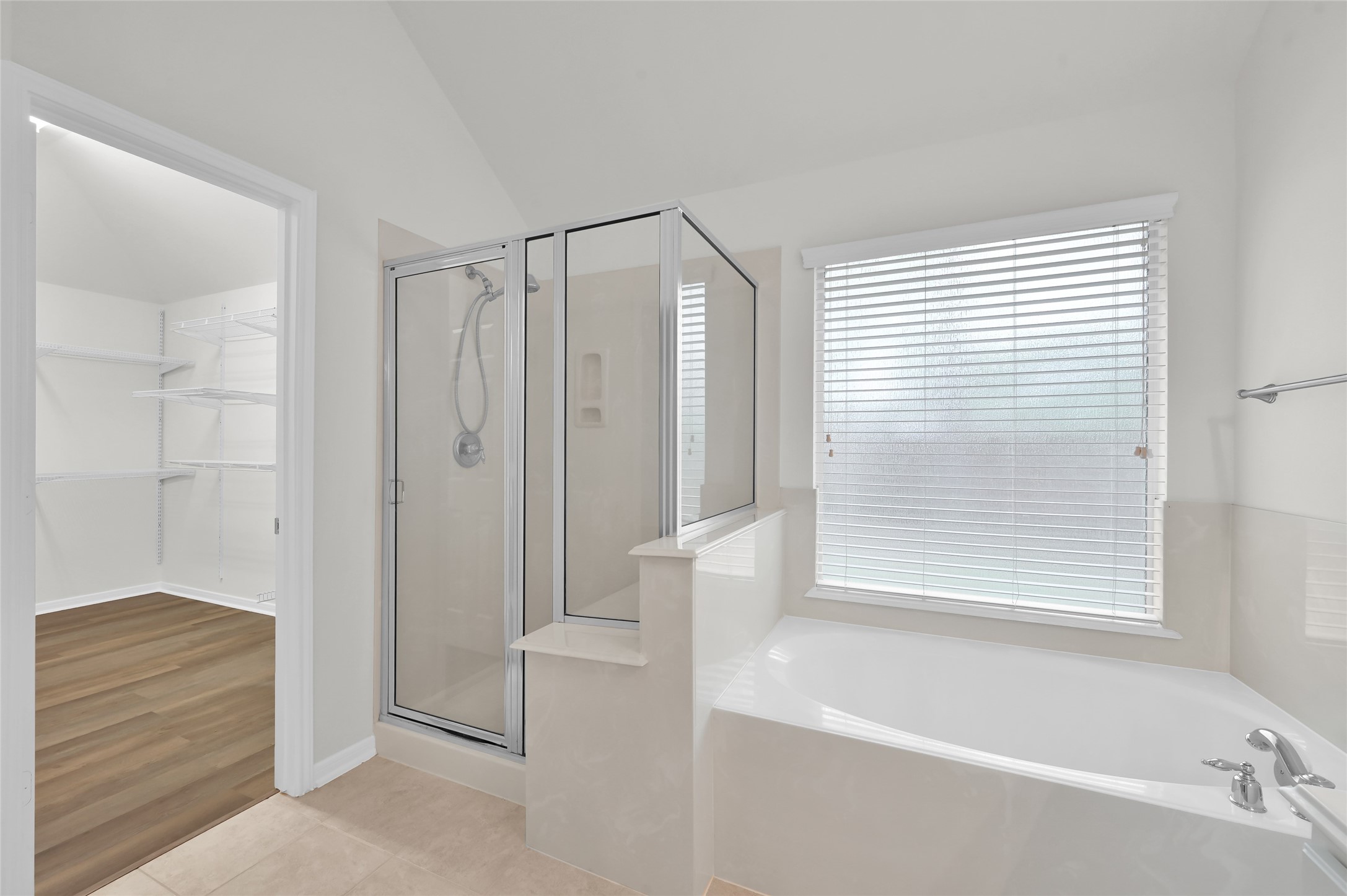 10 Barker Ridge Court Spring, TX 77382 - Photo 16 of 29 a bathroom with a shower and a bathtub