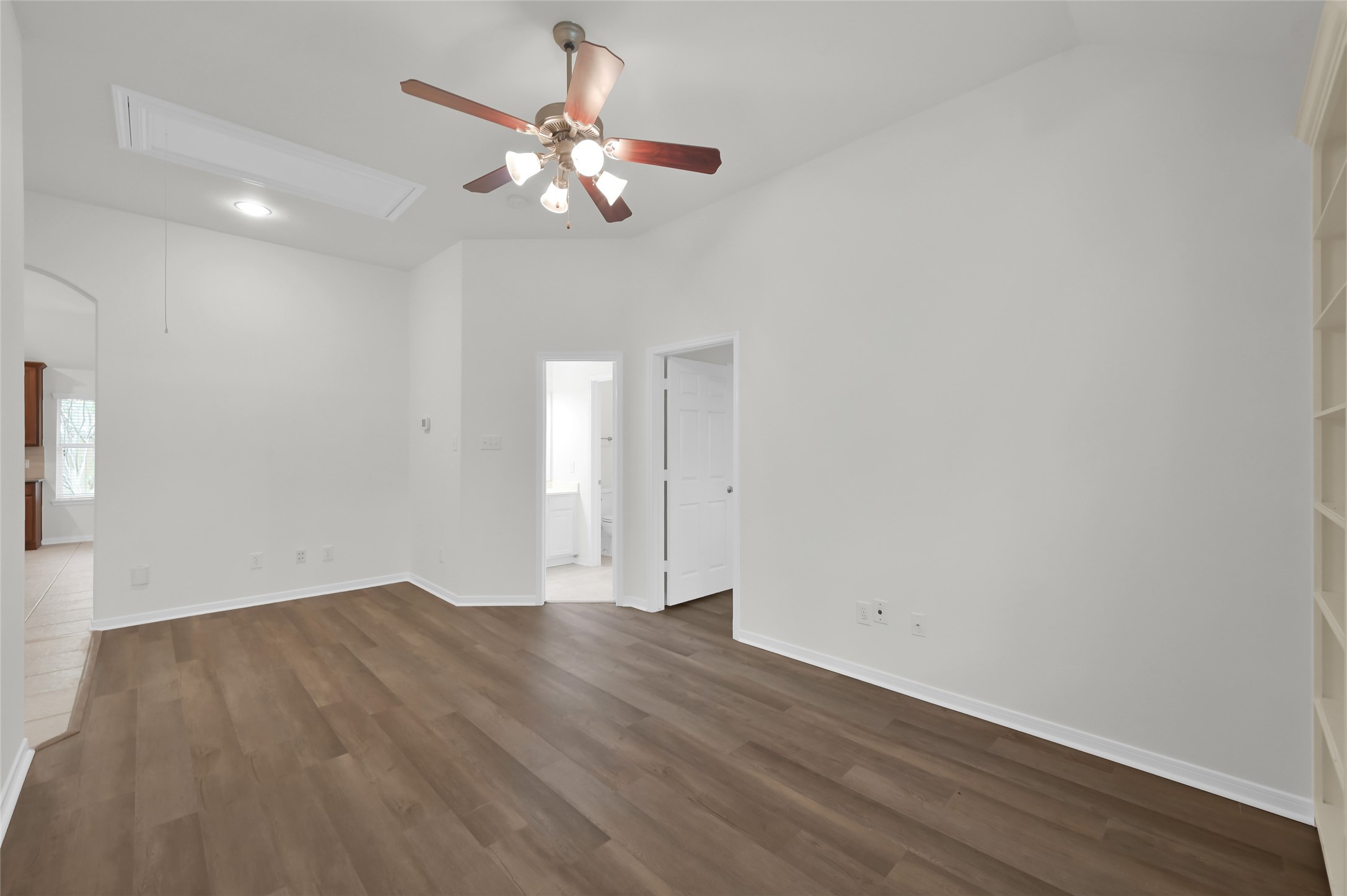 10 Barker Ridge Court Spring, TX 77382 - Photo 19 of 29 a view of an empty room with wooden floor