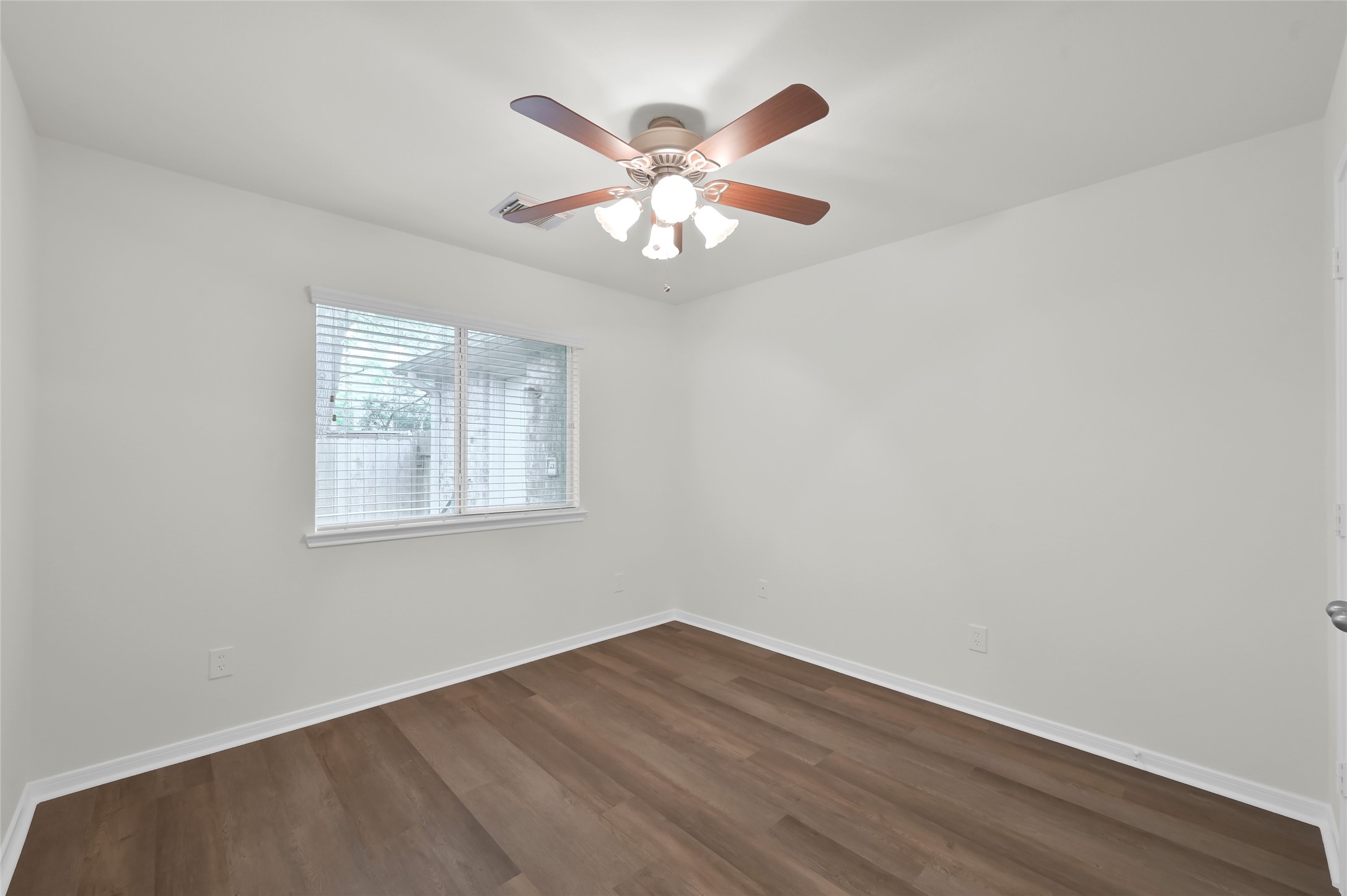 10 Barker Ridge Court Spring, TX 77382 - Photo 20 of 29 wooden floor in an empty room with a window