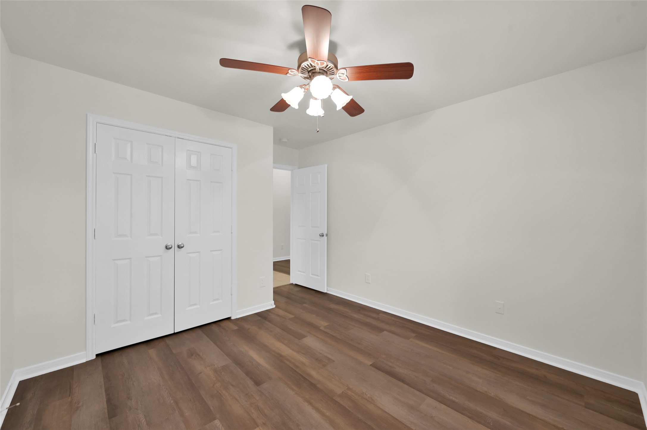 10 Barker Ridge Court Spring, TX 77382 - Photo 21 of 29 a view of an empty room with wooden floor