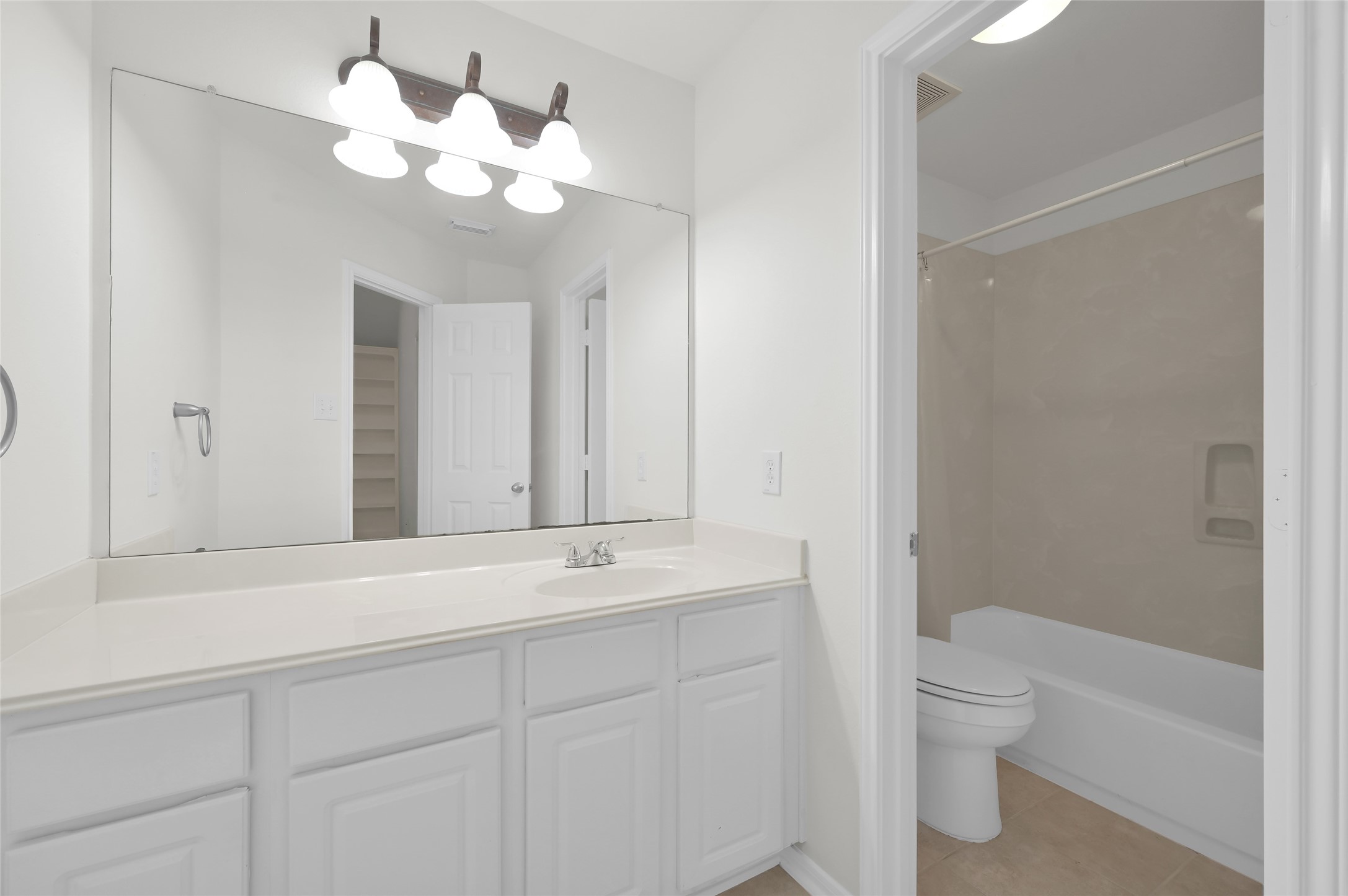 10 Barker Ridge Court Spring, TX 77382 - Photo 22 of 29 a bathroom with a sink a toilet and a mirror