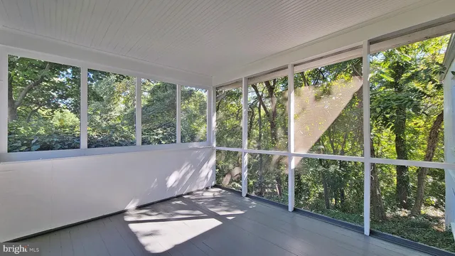 a view of a floor to ceiling window with an outdoor space