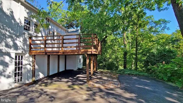 a view of a house with a tree