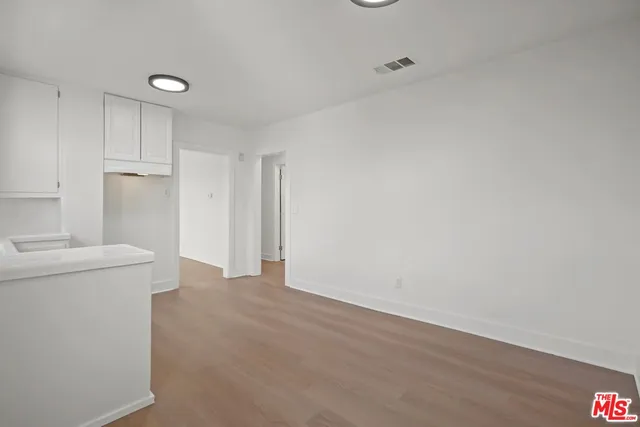 a view of a storage & utility room with a sink