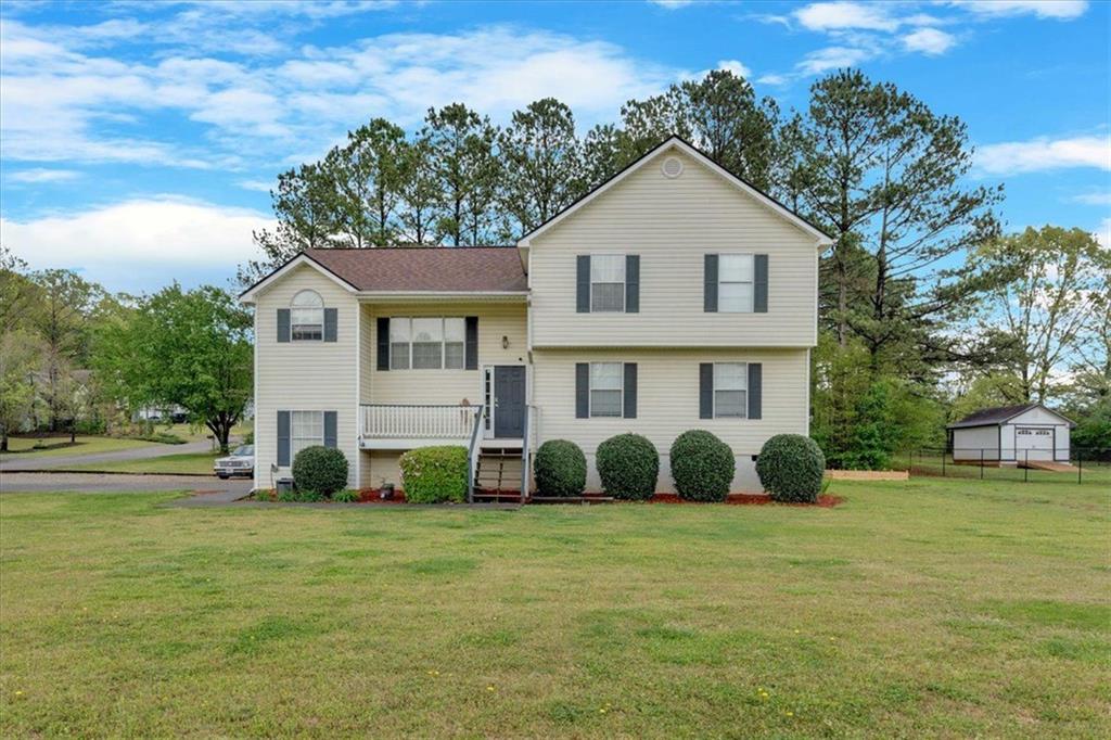 a front view of a house with garden