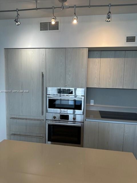 4010 South Ocean Drive, Unit R2702 Hollywood, FL 33019 - Photo 11 of 41 a kitchen with kitchen island a sink a stove and refrigerator