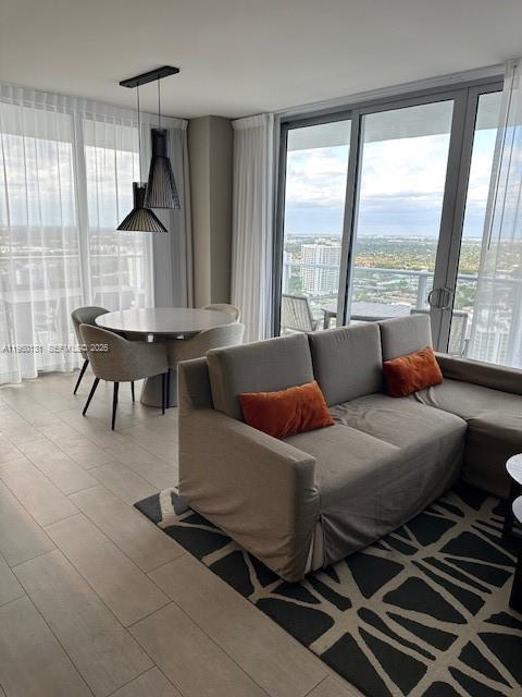 4010 South Ocean Drive, Unit R2702 Hollywood, FL 33019 - Photo 17 of 41 a living room with furniture and a window
