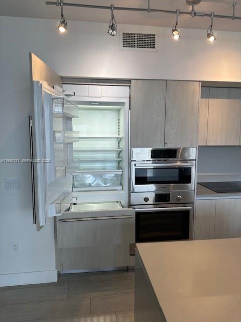 4010 South Ocean Drive, Unit R2702 Hollywood, FL 33019 - Photo 9 of 41 a kitchen with a refrigerator and a sink