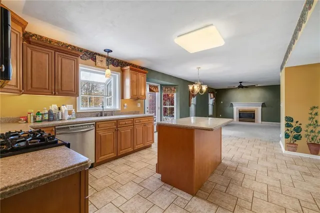 a kitchen with a sink and a stove top oven