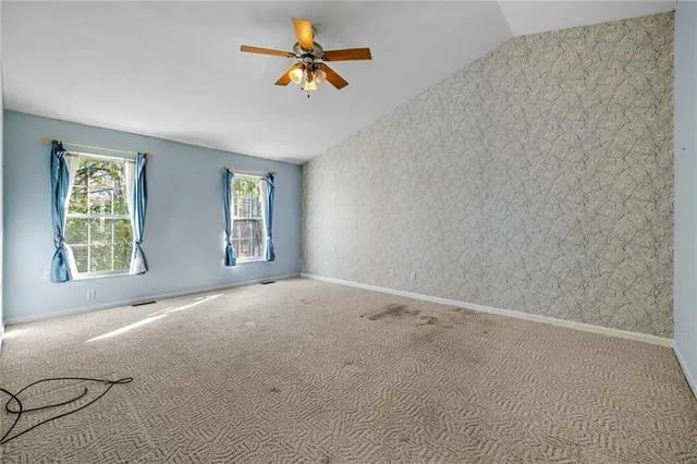 a view of an empty room with a window