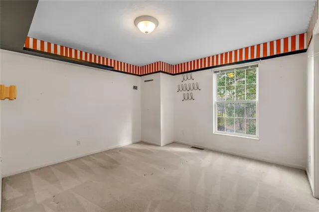 a view of a big room with windows