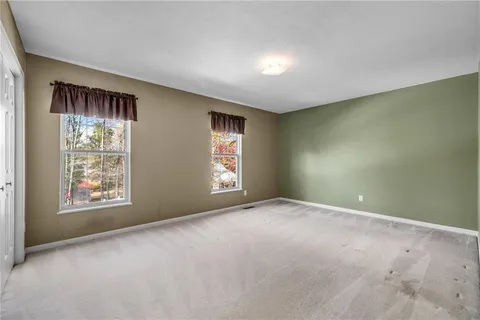 a view of an empty room with windows