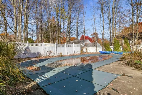 a view of a yard with cars