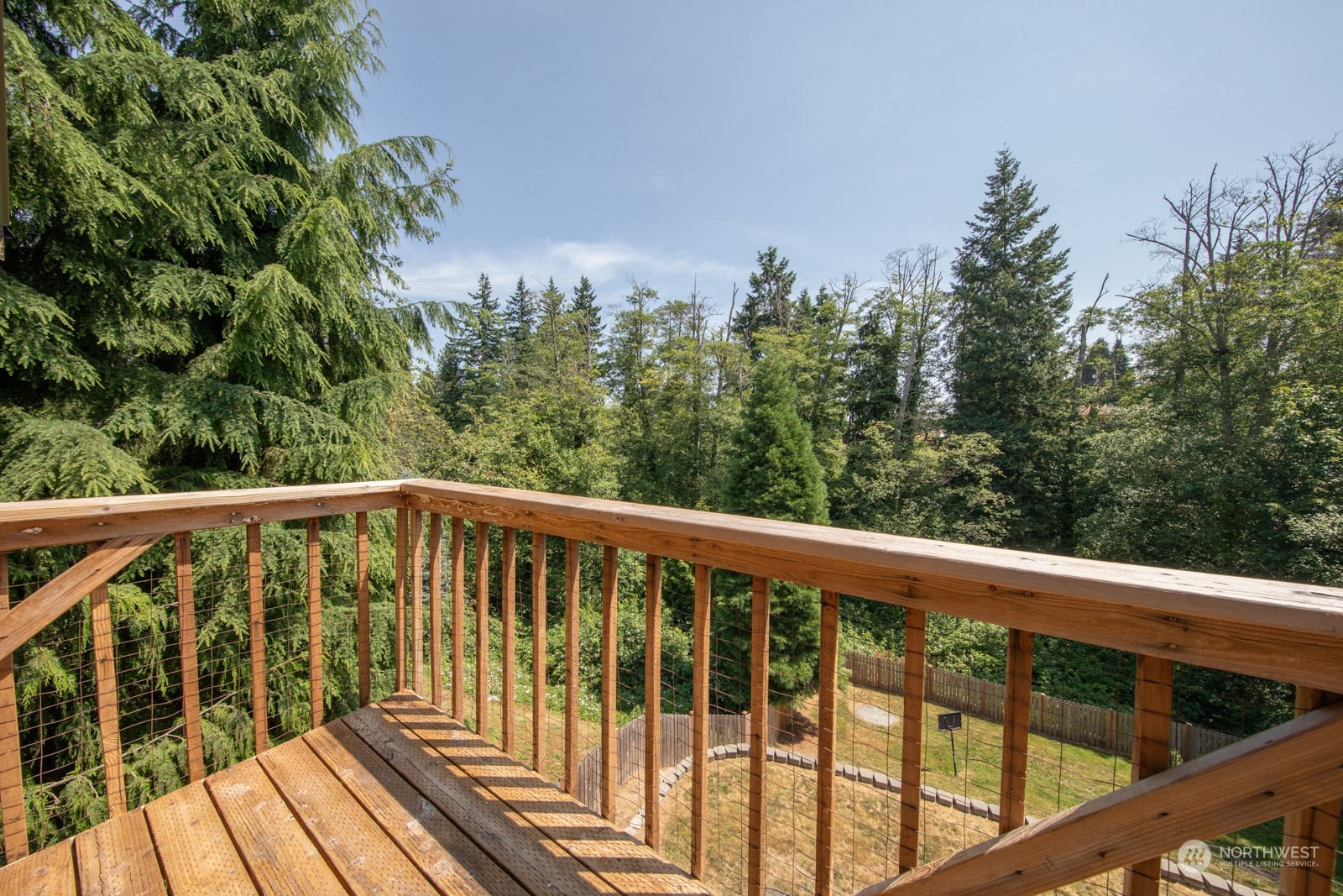 7715 Lower Ridge Road Everett, WA 98203 - Photo 12 of 30 a balcony with wooden floor and fence