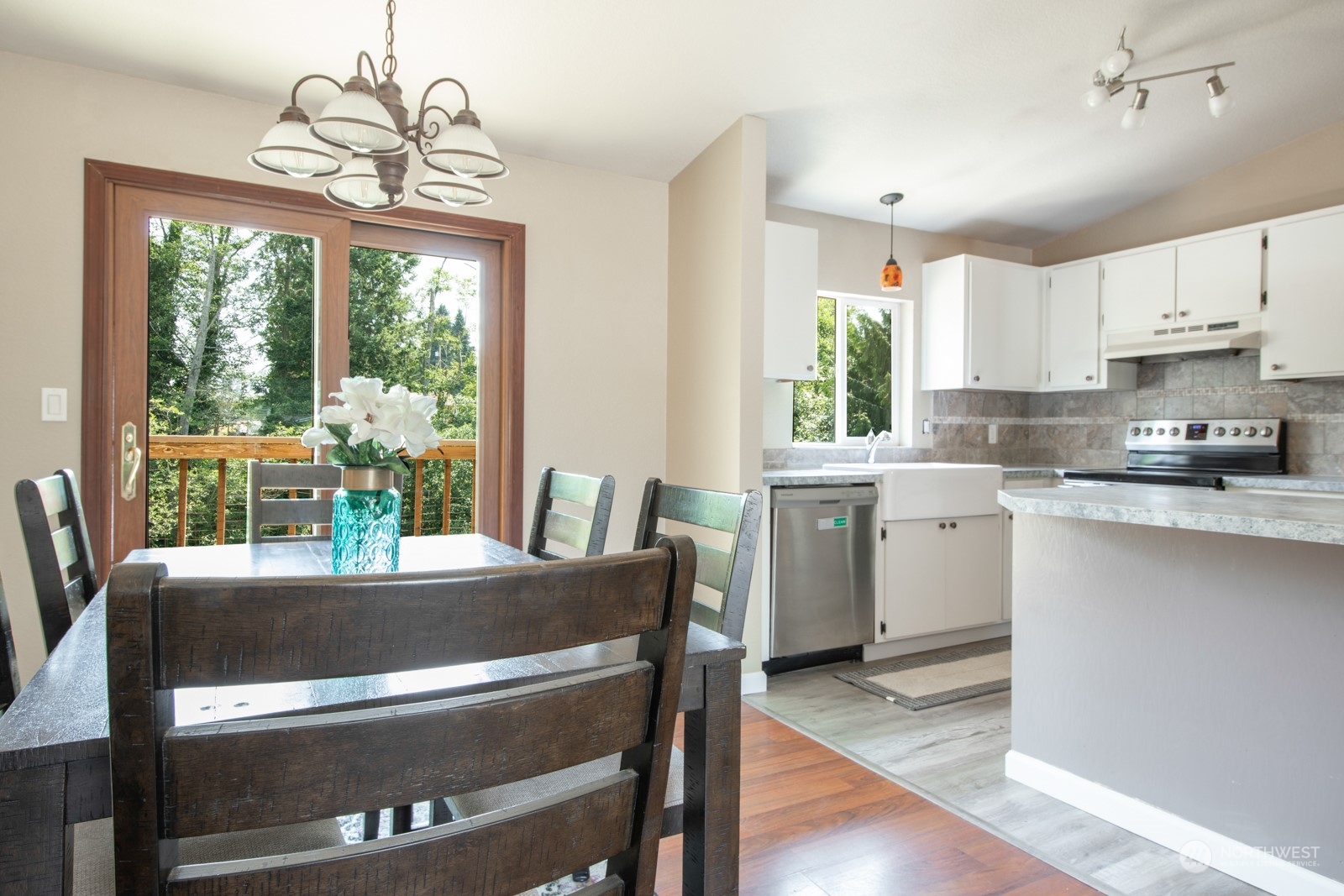 7715 Lower Ridge Road Everett, WA 98203 - Photo 14 of 30 a kitchen with a table chairs and microwave