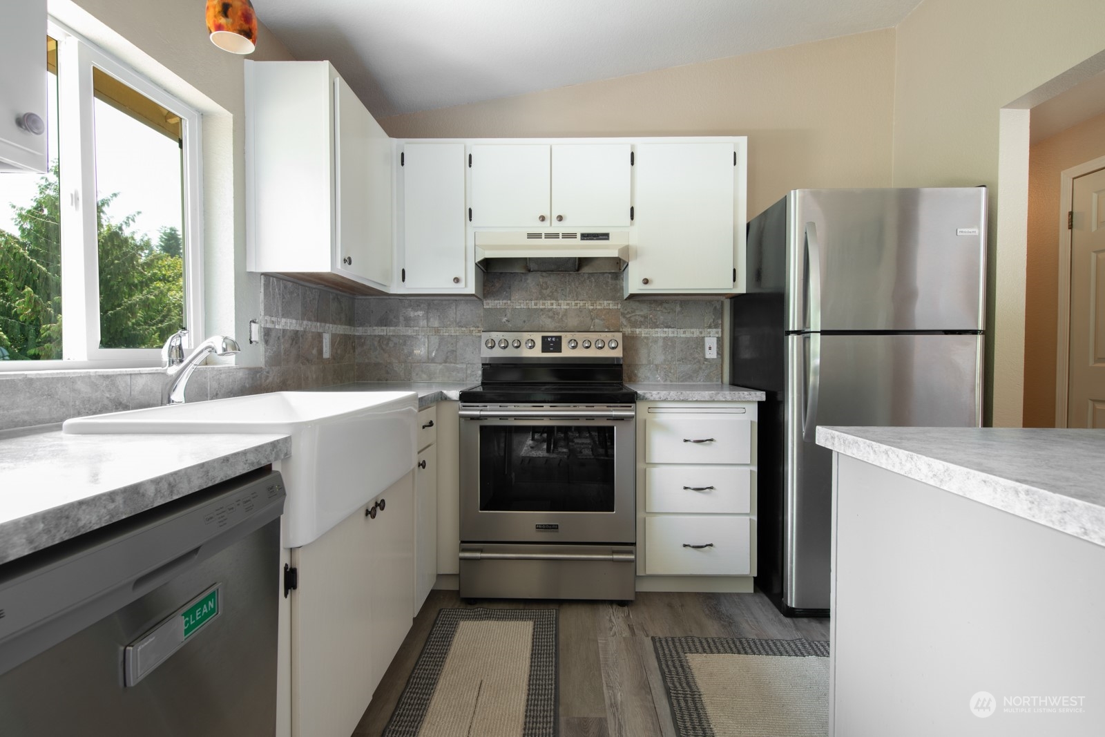 7715 Lower Ridge Road Everett, WA 98203 - Photo 15 of 30 a kitchen with a stove a refrigerator and a sink