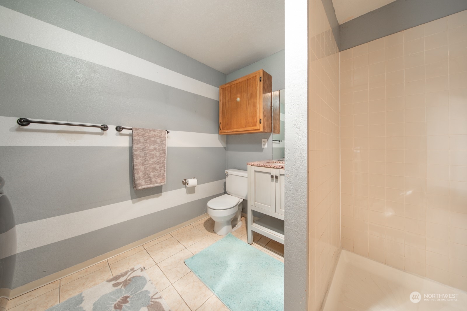 7715 Lower Ridge Road Everett, WA 98203 - Photo 22 of 30 a bathroom with a toilet and a shower