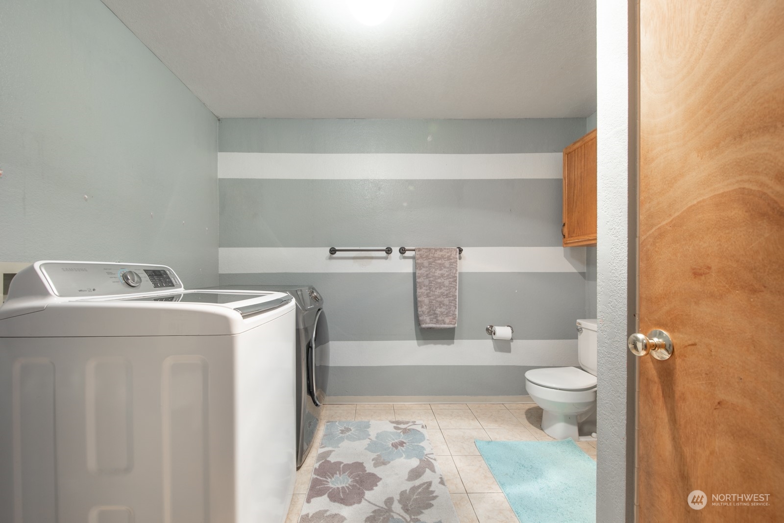 7715 Lower Ridge Road Everett, WA 98203 - Photo 23 of 30 a bathroom with a sink toilet and shower