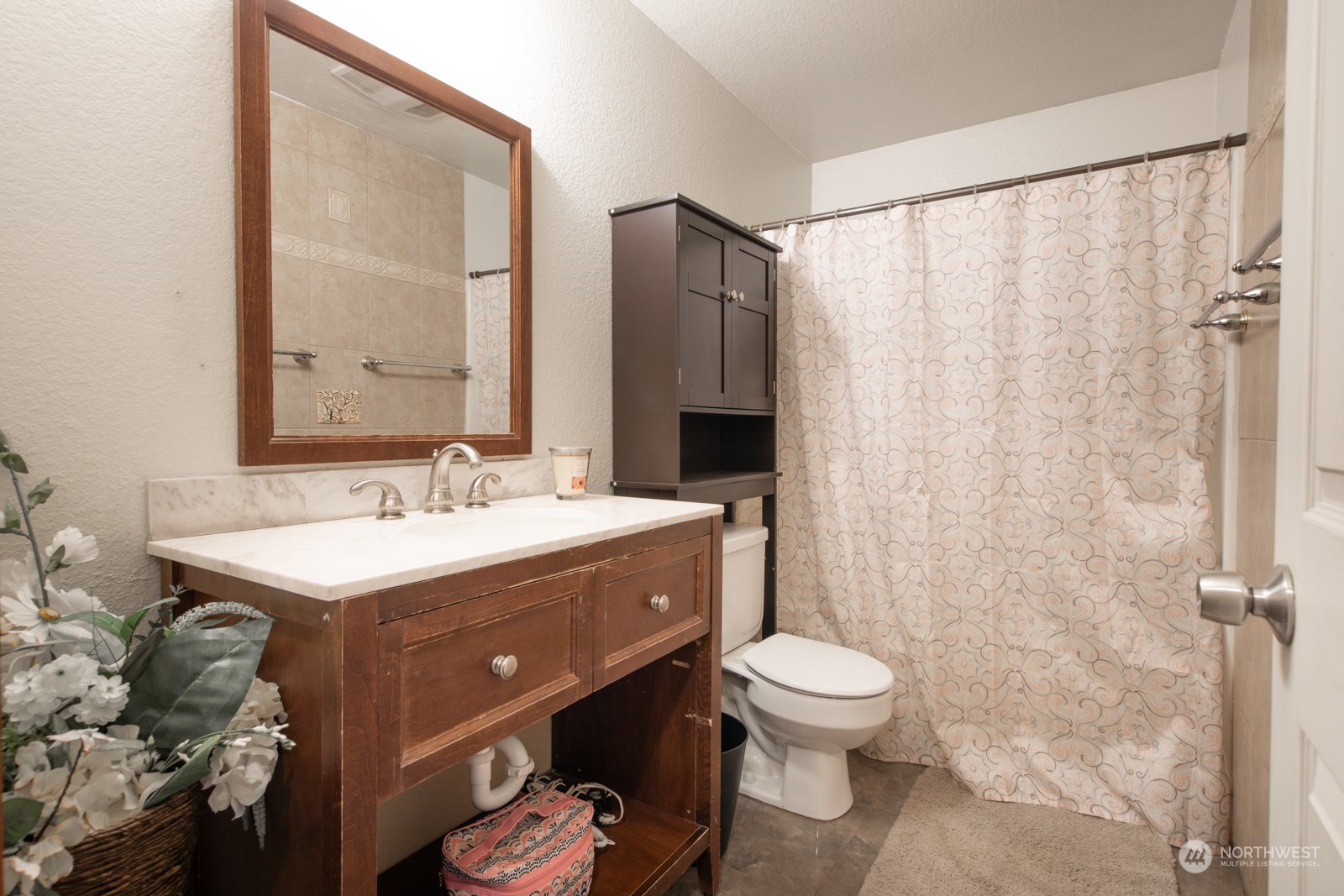 7715 Lower Ridge Road Everett, WA 98203 - Photo 25 of 30 a bathroom with a toilet sink and mirror