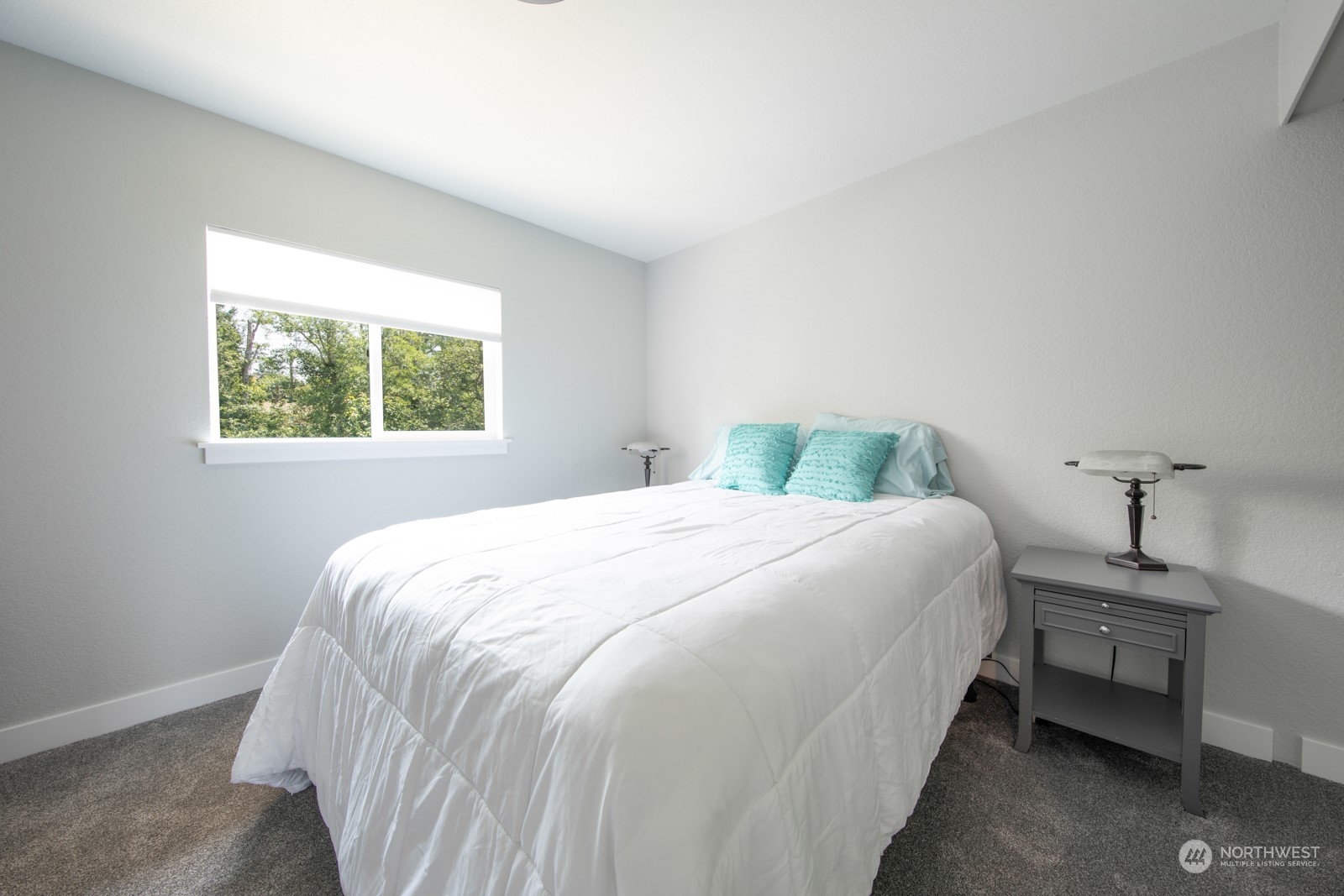 7715 Lower Ridge Road Everett, WA 98203 - Photo 26 of 30 a bedroom with a bed and a window