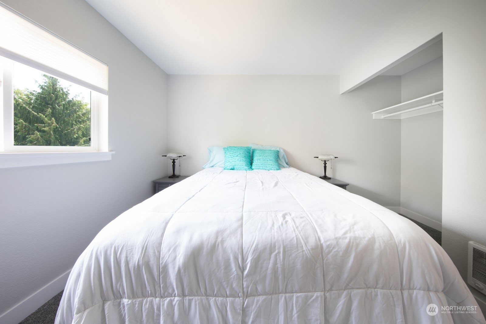 7715 Lower Ridge Road Everett, WA 98203 - Photo 27 of 30 a large bed sitting in a bedroom next to a window