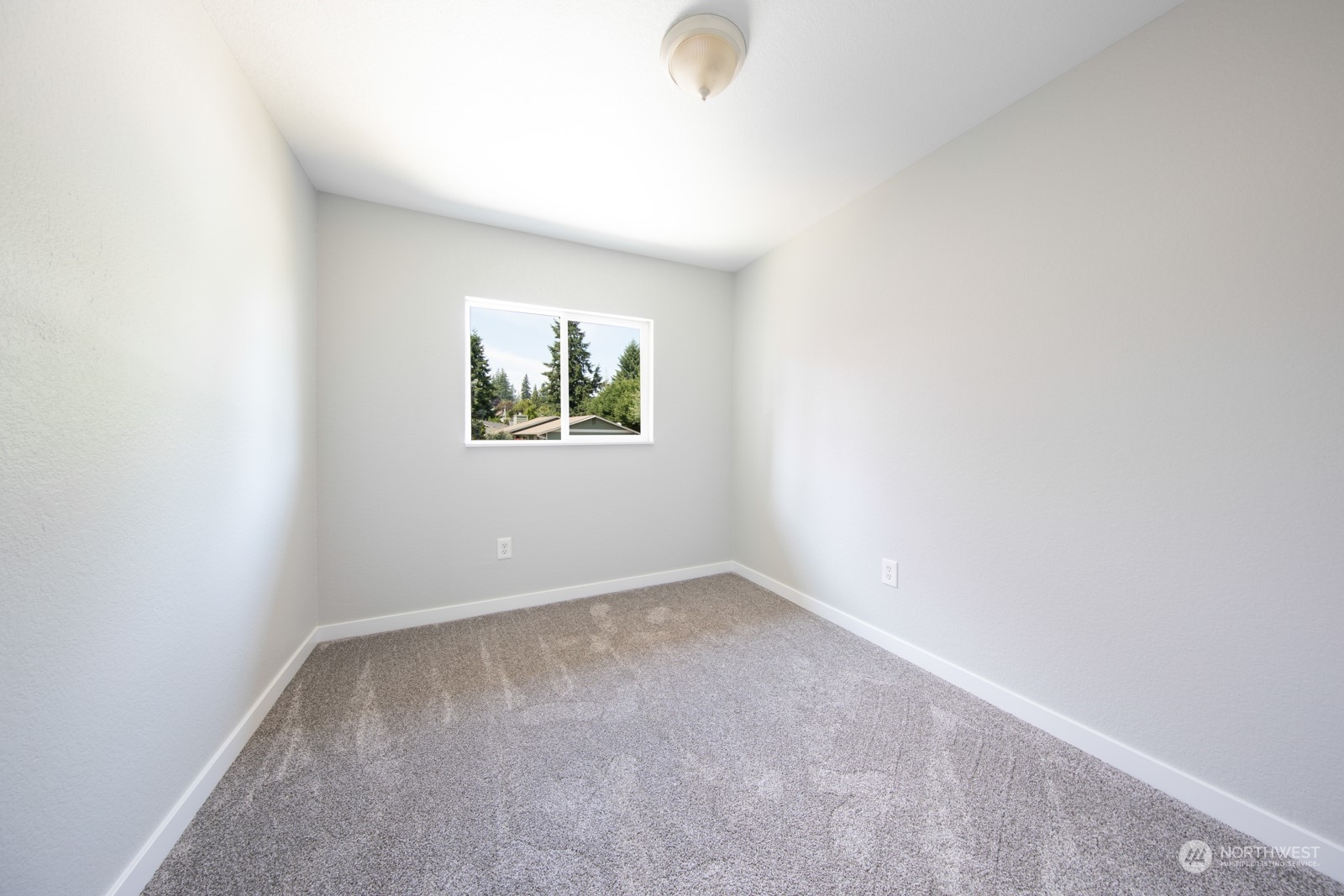 7715 Lower Ridge Road Everett, WA 98203 - Photo 29 of 30 an empty room with windows and a window