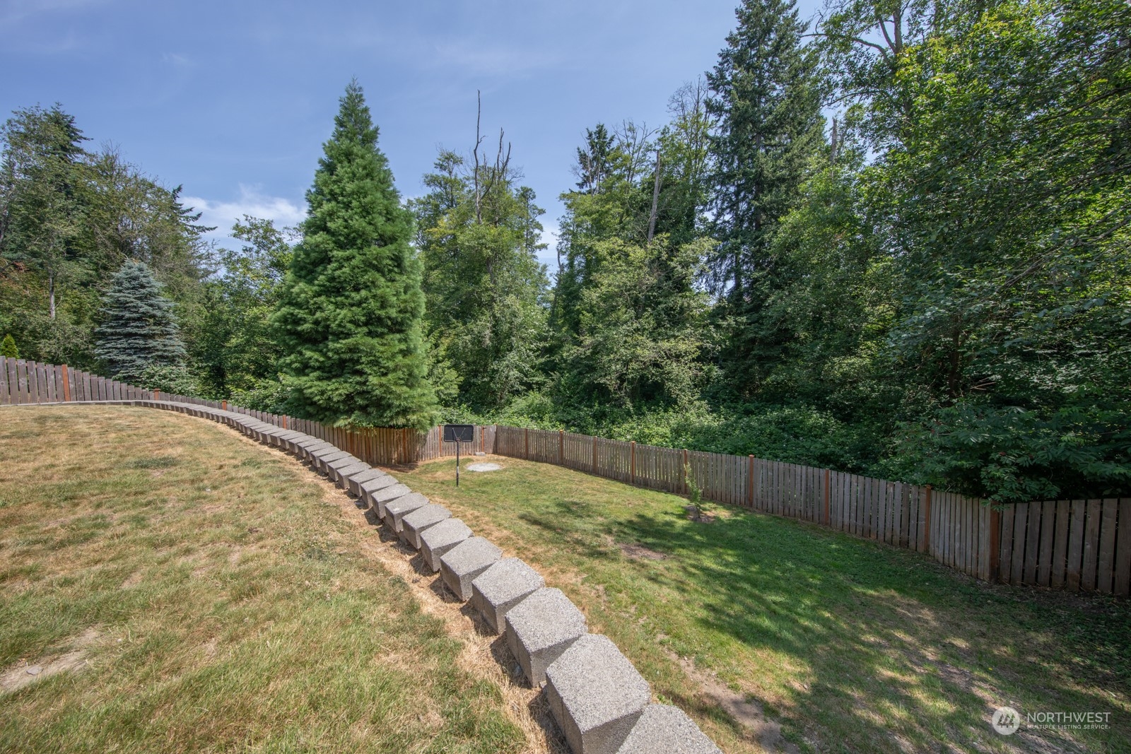 7715 Lower Ridge Road Everett, WA 98203 - Photo 5 of 30 a view of a yard with wooden fence