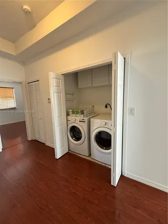 a view of a room with wooden floor and window