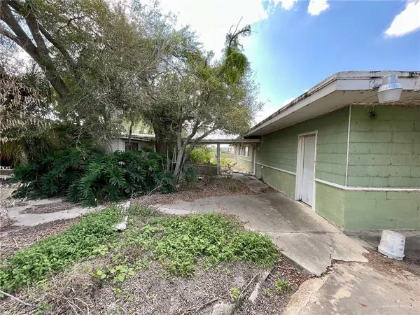 a backyard of a house with lots of green space